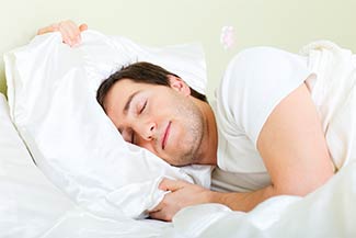 Can Chiropractic Adjustments Help Me Sleep Better? - Man Sound Asleep