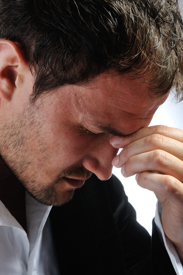 Young man having headache